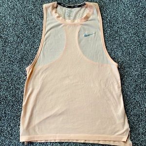 Orange creamsicle colored Nike racer back women’s tank.